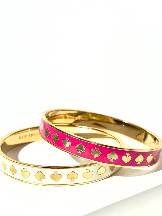 kate spade Jewelry - 2 kate spade ♠️ gold-tone hot to trot spade bangle bracelets - white pink enamel